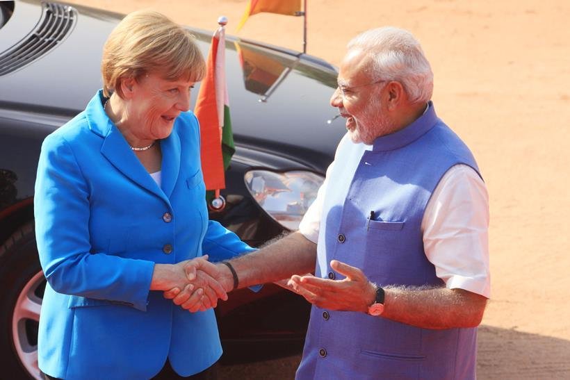 modi-merkel नरेंद्र मोदी फोटोज, नरेंद्र मोदी का साल 2015, पीएम मोदी, मोदी फोटो, narendra modi, modi in 2015, modi photos, best photos of modi 2015, 2015 modi photos, modi and obama, modi yoga photos, modi selfies, modi news, photos of the year, india news, latest news