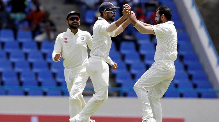 North Sound : India's bowler Mohammed Shami, right, celebrates with teammates taking the wicket of West Indies' Marlon Samuels during day three of their first cricket Test match at the Sir Vivian Richards Stadium in North Sound, Antigua, Saturday, July 23, 2016. AP/PTI(AP7_24_2016_000005B)
