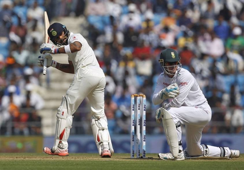 India's captain Virat Kohli , South Africa's wicketkeeper Dane Vilas, first day of third test cricket match in Nagpur, India, November 25, 2015.