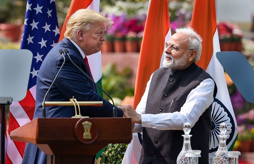 New Delhi: Prime Minister Narendra Modi (R) and US President Donald Trump exchange greetings after their joint press statement, at the Hyderabad House in New Delhi, Tuesday, Feb. 25, 2020. (PTI Photo/Kamal Singh) (PTI2_25_2020_000126B)