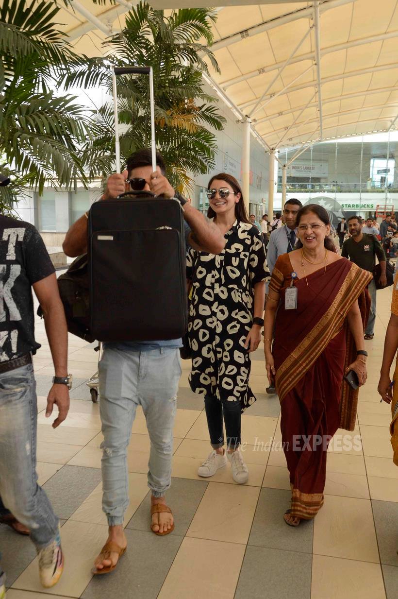 Virat kohli, anushka sharma, madhuri dixit, mumbai airport, kapil sharma, varun dhawan, bollywood starts spot at airport, bollywood stars photos, virat-anuska latest photos