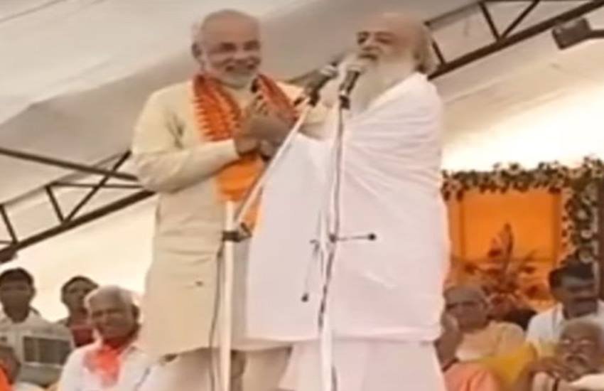 नरेंद्र मोदी, जेडीयू, बीजेपी, नीतीश कुमार, आसाराम के साथ मोदी, भाजपा, बिहार चुनाव, तांत्रिक के साथ नीतीश, latest news, hindi news, news in hindi, JDU, BJP, Bihar CM, Nitish Kumar, tantrik, video war, narendra modi, modi with asaram, Prime Minister Narendra Modi, 'jantar mantar' partners