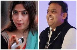 यूपी के सीएम अख‍िलेश यादव और उनकी पत्नी और सांसद डिंपल यादव। (PTI)
