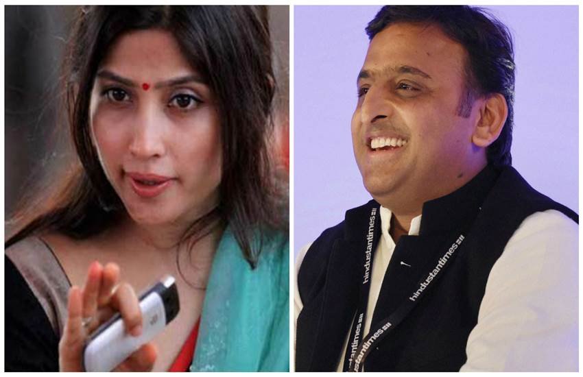 यूपी के सीएम अख‍िलेश यादव और उनकी पत्नी और सांसद डिंपल यादव। (PTI)