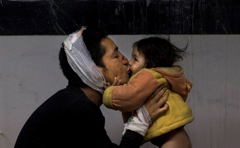 Photos Of The Year, Vladimir Putin workout, Mark Zuckerberg daughter, Barack Obama selfie, photo gallery of the year, picture of Jayalalithaa, Brazil President, Dilma Rousseff, German Chancellor, Angela Merkel, US President, Barack Obama, Charlie Hebdo shootings, Rohingya Bangladeshi migrants, Palestinian protester, nepal Earthquake, 100 lashes, Hungarian police, Syrian refugee, French President, Francois Hollande, रूसी राष्‍ट्रपति, व्‍लादिमिर पुतिन, बराक ओबामा, जयललिता, सीरियाई शरणार्थी, एंजेला मर्केल, 2015 की तस्‍वीरें, बेहतरीन तस्‍वीरें
