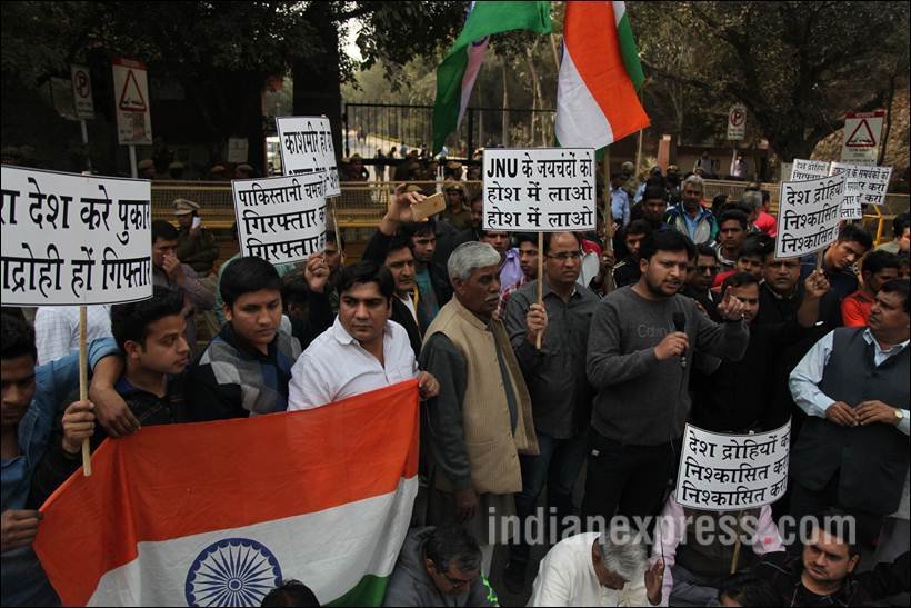 Local residents of Munirka area protest outside the gates of the JNU, against a function that was allegedly anti national in nature praising Afzal Guru on campus, in the capital New Delhi on friday. Delhi Police security was provided at the entrance to the JNU during the protest. Express Photo by Tashi Tobgyal New Delhi 120216