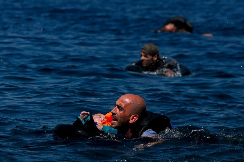 top photos of the 2016, photo of the year 2016, international photos, wolrd photos, Saudi security forces, military exercise, west of Riyadh, Saudi Arabia, barack obama daughter malia, barack obama malia pics, heavy rains in peshawar, floods in peshawar, top frames, top photos, photos of the year, top frames of the 2016, Villarrica Volcano, white-tailed eagle, Khrapkov, "Photos Of The Year, Vladimir Putin workout, Mark Zuckerberg daughter, Barack Obama selfie, photo gallery of the year, picture of Jayalalithaa, Brazil President, Dilma Rousseff, German Chancellor, Angela Merkel, US President, Barack Obama, Charlie Hebdo shootings, Rohingya Bangladeshi migrants, Palestinian protester, nepal Earthquake, 100 lashes, Hungarian police, Syrian refugee, French President, Francois Hollande 2015 की तस्‍वीरें, बेहतरीन तस्‍वीरें