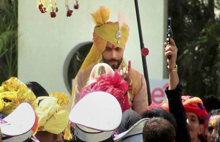 Ravindra Jadeja, Ravindra Jadeja marriage, ravindra jadeja firing, ravindra jadeja celebratory firing, ravindra jadeja wedding, jadeja marriage, jadeja wife, riva solanki, jadeja firing, jadeja marriage firing, रवींद्र जडेजा, जडेजा फायरिंग, जडेजा शादी, जडेजा पत्‍नी