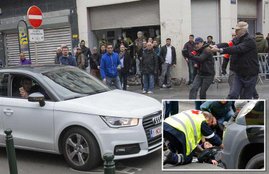 Muslim woman, mown, anti Islam rally, Brussels district, Molenbeek, isis, islamic state in beljium, trouble in brussels