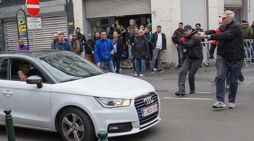 Muslim woman, mown, anti Islam rally, Brussels district, Molenbeek, isis, islamic state in beljium, trouble in brussels