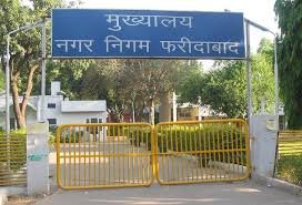 nagar nigam, faridabaad news, hariyana news, bmw showroom seized in faridabaad