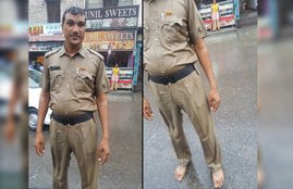 Policeman, Policeman From Haryana, Haryana Policeman, Pictures of Haryana Policeman, Policeman Pictures Goes Viral, Haryana Policeman Barefoot in Heavy Rains,