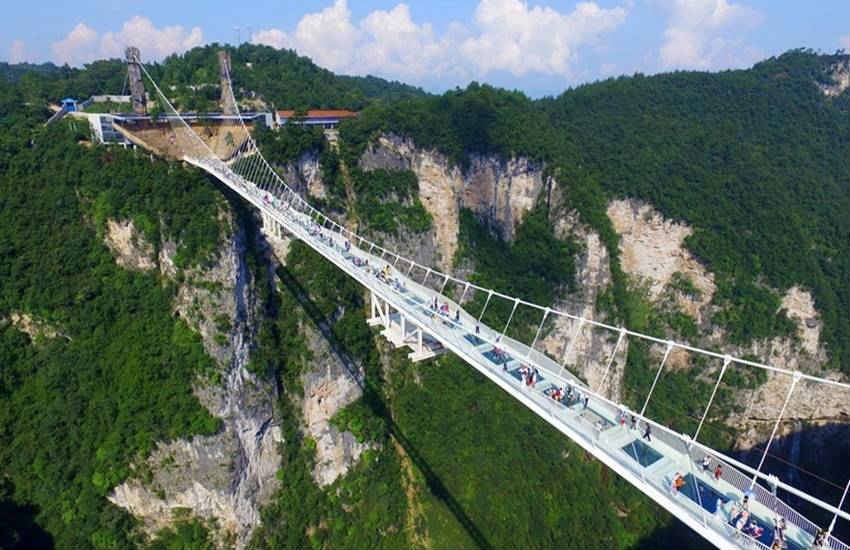 china, china glass bridge, china glass bottom bridge, china glass skywalk, Zhangjiajie china, Zhangjiajie park glass bridge, longest and highest bridge, world lonest and highest bridge, Zhangjiajie park glass bridges, china news, latest news, trnding news, china glass bride photos, Zhangjiajie glass bridge photos