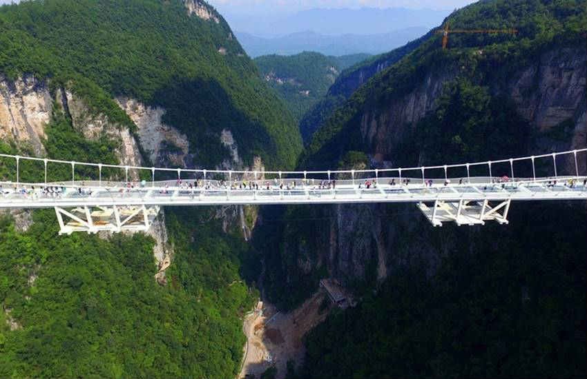 china, china glass bridge, china glass bottom bridge, china glass skywalk, Zhangjiajie china, Zhangjiajie park glass bridge, longest and highest bridge, world lonest and highest bridge, Zhangjiajie park glass bridges, china news, latest news, trnding news, china glass bride photos, Zhangjiajie glass bridge photos