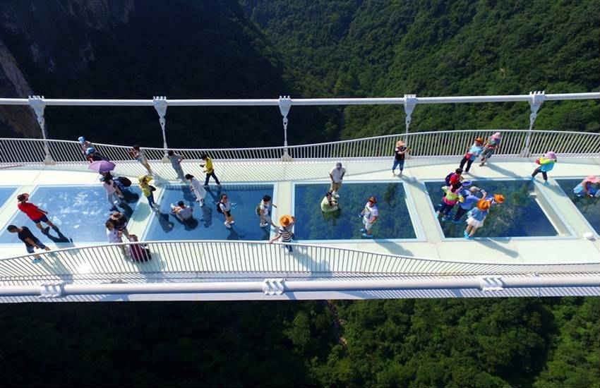 china, china glass bridge, china glass bottom bridge, china glass skywalk, Zhangjiajie china, Zhangjiajie park glass bridge, longest and highest bridge, world lonest and highest bridge, Zhangjiajie park glass bridges, china news, latest news, trnding news, china glass bride photos, Zhangjiajie glass bridge photos