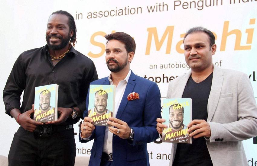 बीसीसीआई अध्यक्ष अनुराग ठाकुर और वीरेन्द्र सहवाग क्रिस गेल की आत्मकथा 'सिक्स मशीन' के लॉन्चिग के दौरान। (Photo source: PTI) बीसीसीआई अध्यक्ष अनुराग ठाकुर और वीरेन्द्र सहवाग क्रिस गेल की आत्मकथा 'सिक्स मशीन' के लॉन्चिग के दौरान। (Photo source: PTI)