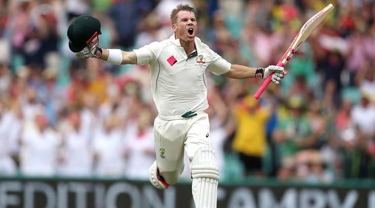 Australia's David Warner raises his arms to celebrate making 100 runs against Pakistan during their cricket test match in Sydney, Australia, Tuesday, Jan. 3, 2017. (AP Photo/Rick Rycroft)
