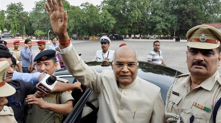 Patna: Bihar Governor Ram Nath Kovind, NDA's presidential candidate, waves at the media as he leaves for Delhi, at Raj Bhavan in Patna on Monday. PTI Photo (PTI6_19_2017_000138B)