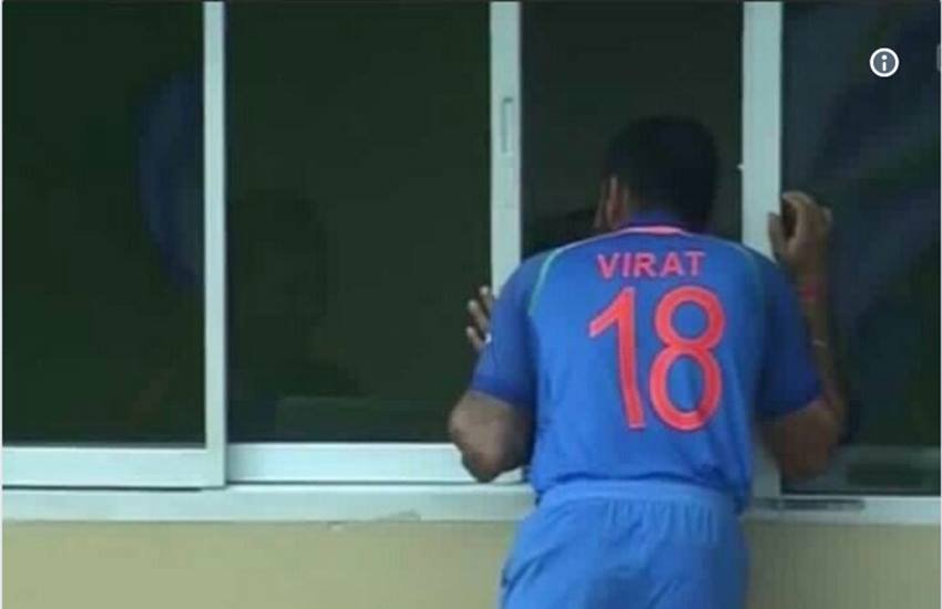 भारत-वेस्टइंडीज मैच में बारिश के खलल के बाद ड्रेसिंग रूम में झांकते विराट कोहली। भारत-वेस्टइंडीज मैच में बारिश के खलल के बाद ड्रेसिंग रूम में झांकते विराट कोहली।