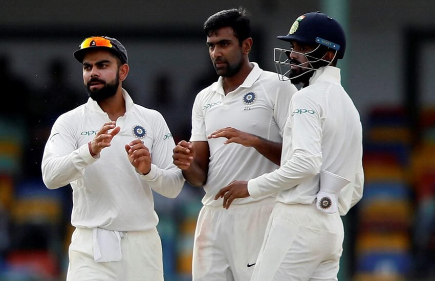 Ashwin celebrates with captain Virat Kohli and Lokesh Rahul