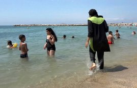burkini, burkini clad woman, Swimsuit, sweamwear, Portugal, France, swimming pool, trending news, International news, Hindi news