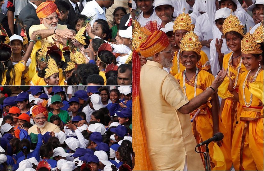 अपने चाहने वालों के लिए पीएम नरेंद्र मोदी हमेशा ही भागे दौड़े रहते हैं। उनके पास चाहे जितनी कड़ी सुरक्षा हो लेकिन अगर उनसे मिलने के लिए दूर से कोई हाथ हिलाए और उनकी नजर उस पर पड़ जाए तो वे बिना सोचे समझे उससे मिले चले जाते हैं। जी हां, हमेशा की तरह पीएम मोदी फिर से प्रोटोकॉल छोड़कर इस बार बच्चों से मिले। मौका था 15 अगस्त यानी स्वतंत्रता दिवस और जनमाष्टमी त्योहार का। इस दौरान पीएम मोदी अपनी कड़ी सुरक्षा को तोड़कर बच्चों से मिलने पहुंचे। पीएम मोदी ने कान्हा बने बच्चों से मुलाकात की। देखिए बच्चों के बीच पीएम की मुलाकात की कुछ मनमोहक तस्वीरें। (PTI)