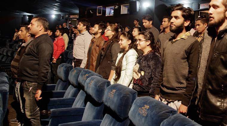 सिनेमा हॉल में राष्ट्रगान करते लोग (express PHOTO)