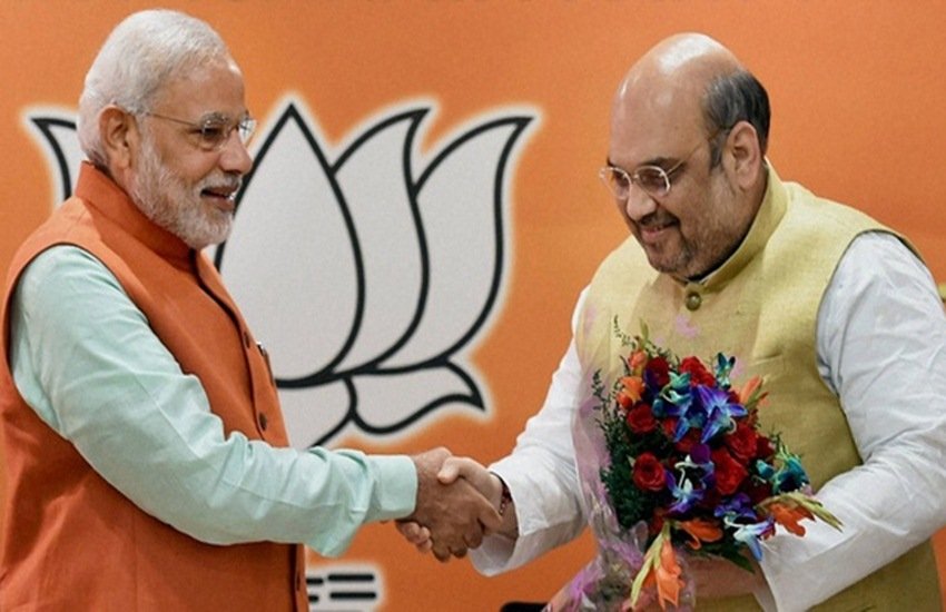 पीएम नरेंद्र मोदी व अमित शाह।