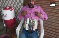 VIDEO: फर्जी मानव बम बन पहुंच गया बैंक लूटने, पुलिस ने दबोचा