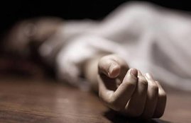 Dead woman's body with focus on hand