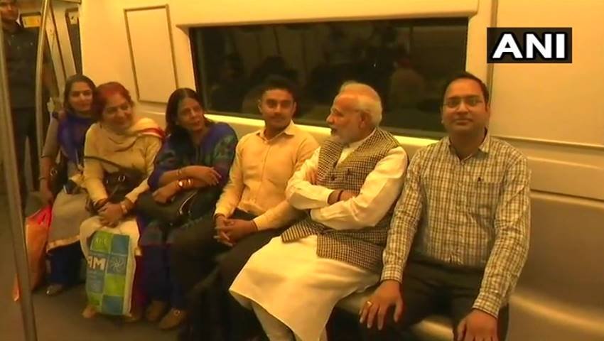 Narendra Modi, Narendra Modi in metro, Narendra Modi in delhi metro, Narendra Modi metro pics, Narendra Modi metro photos, Narendra Modi metro picutres, selfie with modi, selfie with modi in metro, selfie with modi in delhi, selfie with modi in delhi metro, Prime Minister Narendra Modi, Prime Minister Narendra Modi in metro, photo gallery