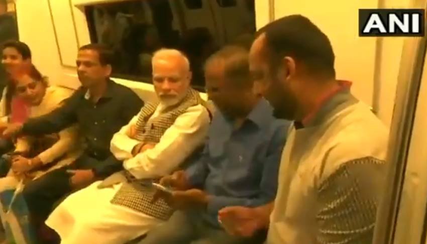 Narendra Modi, Narendra Modi in metro, Narendra Modi in delhi metro, Narendra Modi metro pics, Narendra Modi metro photos, Narendra Modi metro picutres, selfie with modi, selfie with modi in metro, selfie with modi in delhi, selfie with modi in delhi metro, Prime Minister Narendra Modi, Prime Minister Narendra Modi in metro, photo gallery