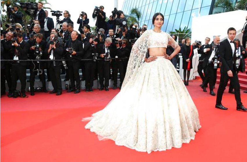 cannes 2018: sonam kapoor, sonam kapoor reaches at red carpet of cannes, sonam in cannes 2018, sonam looks bride with mehandi at cannes, sonam with mehandi on her hands, sonam wore cream eligent lehanga, see pictures of sonam kapoor in cannes film festival, sonam kapoor at cannes film festival, entertainment news, bollywood news, television news