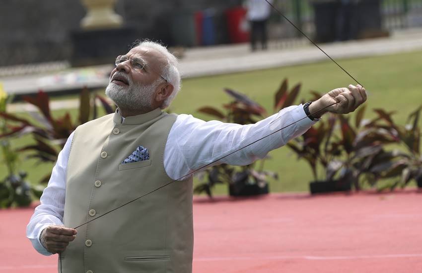 pm modi's indonesia visit,pm modi fly kites,Modi in Mosque, Indonesian President Joko Widodo, Merdeka Palace in Jakarta, modi, modi flying kite