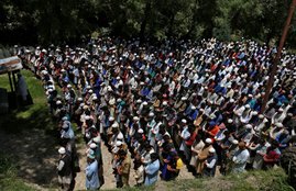 People offer funeral prayers for Ghulam Hassan Wagay during his funeral at Wohlutra village in north Kashmir's Baramulla district