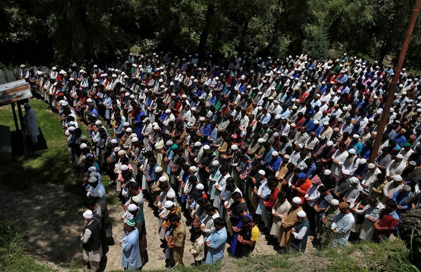 People offer funeral prayers for Ghulam Hassan Wagay during his funeral at Wohlutra village in north Kashmir's Baramulla district