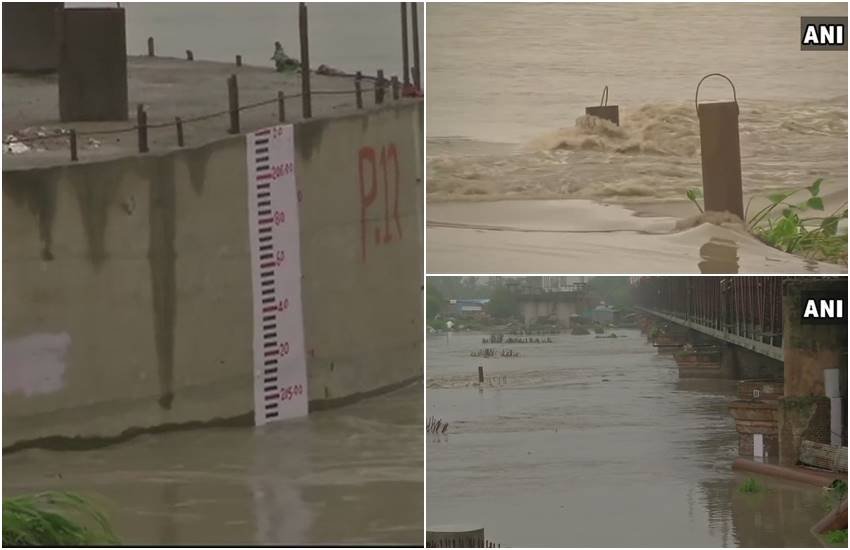 यमुना का जलस्‍तर लगातार बढ़ रहा है। (Photos : ANI)