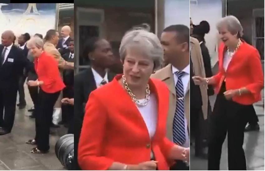 Theresa May, Prime Minister, British PM, Britain, Dance, Dance Video, Viral Video, Laugh, Kids, School Kids, Officers, Mkize Senior Secondary School, Cape Town, South Africa, Foreign Tour, International News, Trending News, Hindi News