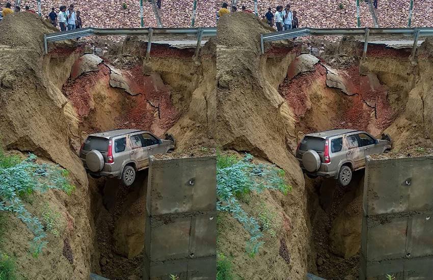 15 फीट गहरे गढ्डे में गिरी कार (फोटो-पीटीआई)