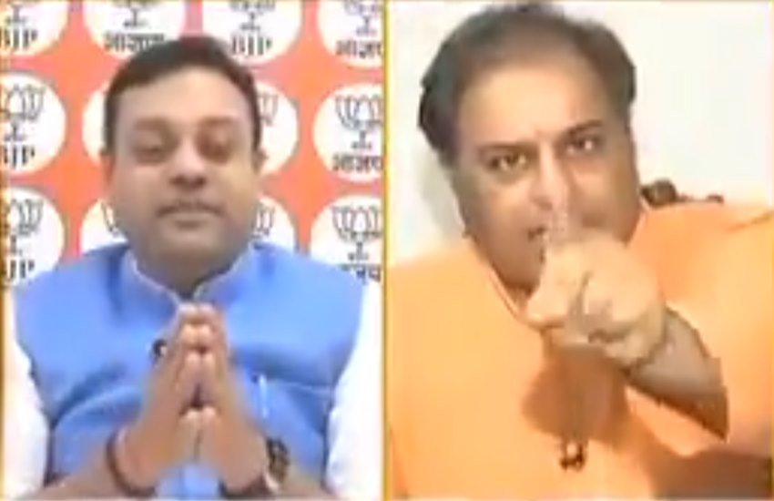 बीजेपी प्रवक्‍ता संबित पात्रा और कांग्रेस नेता राजीव त्‍यागी। (फोटो सोर्स: वीडियो ग्रैब)