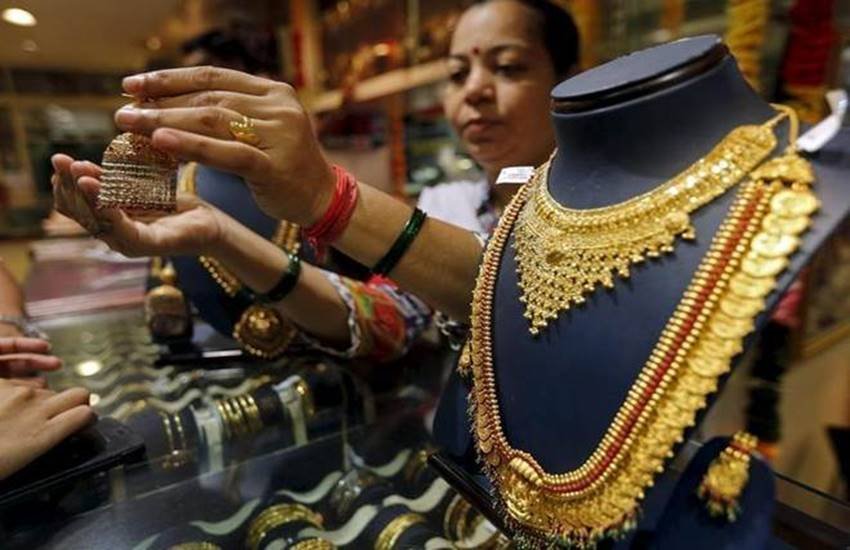 सोने का मूल्य उसकी शुद्धता से निर्धारित होता है।
(फोटो सोर्स : Financial Express)