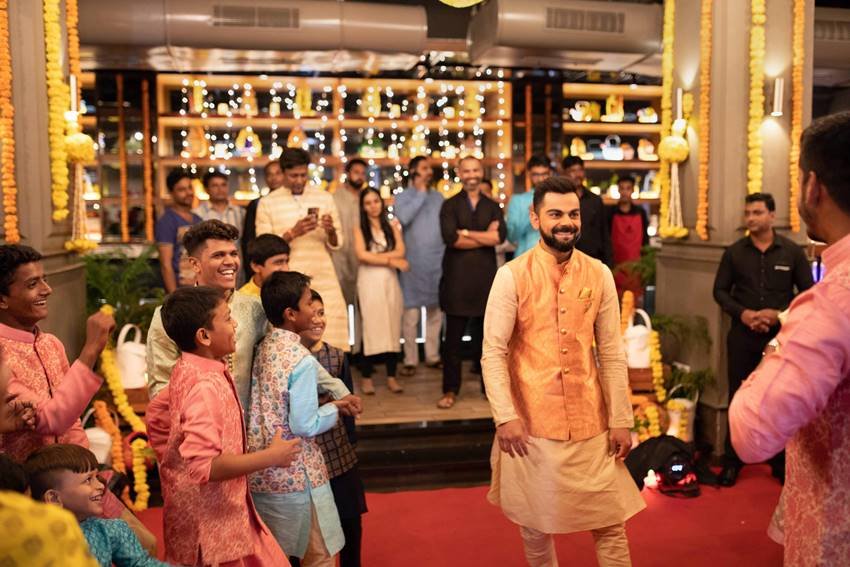 Virat Kohli Style, Stylish Indian Cricketers, Virat Kohli MensXP, Virat Kohli Fashion, Virat Kohli Dharavi kids, Virat Kohli Diwali, Virat Kohli Manyavar, kohli diwali with kids, kohli latest pics
