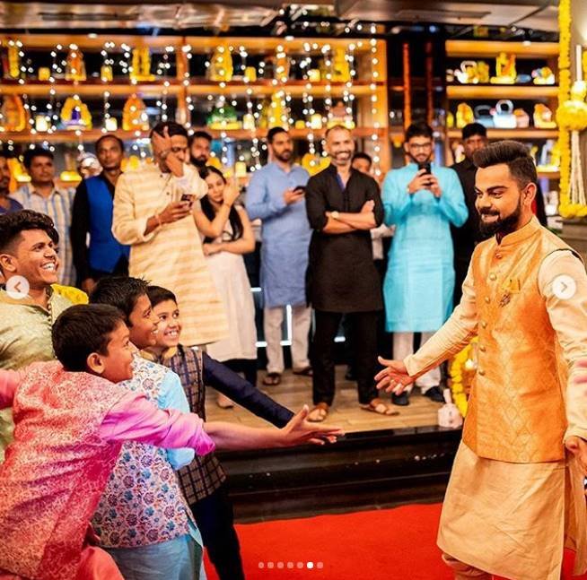 Virat Kohli Style, Stylish Indian Cricketers, Virat Kohli MensXP, Virat Kohli Fashion, Virat Kohli Dharavi kids, Virat Kohli Diwali, Virat Kohli Manyavar, kohli diwali with kids, kohli latest pics