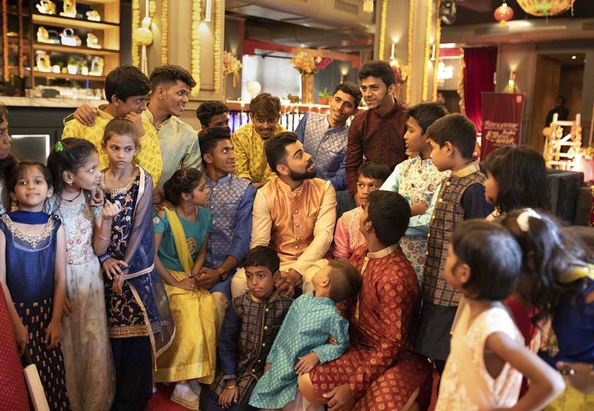 Virat Kohli Style, Stylish Indian Cricketers, Virat Kohli MensXP, Virat Kohli Fashion, Virat Kohli Dharavi kids, Virat Kohli Diwali, Virat Kohli Manyavar, kohli diwali with kids, kohli latest pics