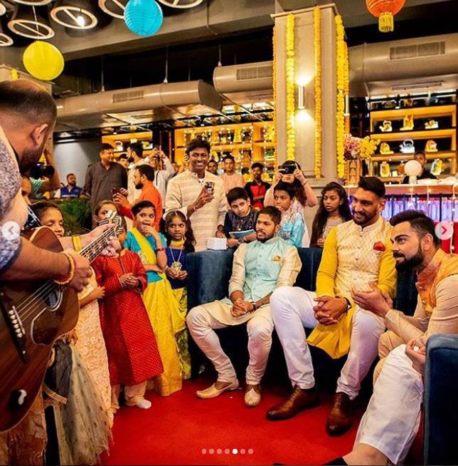 Virat Kohli Style, Stylish Indian Cricketers, Virat Kohli MensXP, Virat Kohli Fashion, Virat Kohli Dharavi kids, Virat Kohli Diwali, Virat Kohli Manyavar, kohli diwali with kids, kohali latest pics
