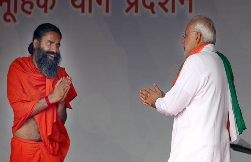 बाबा रामदेव और पीएम नरेंद्र मोदी 
फोटो सोर्स- इंडियन एक्सप्रेस 
