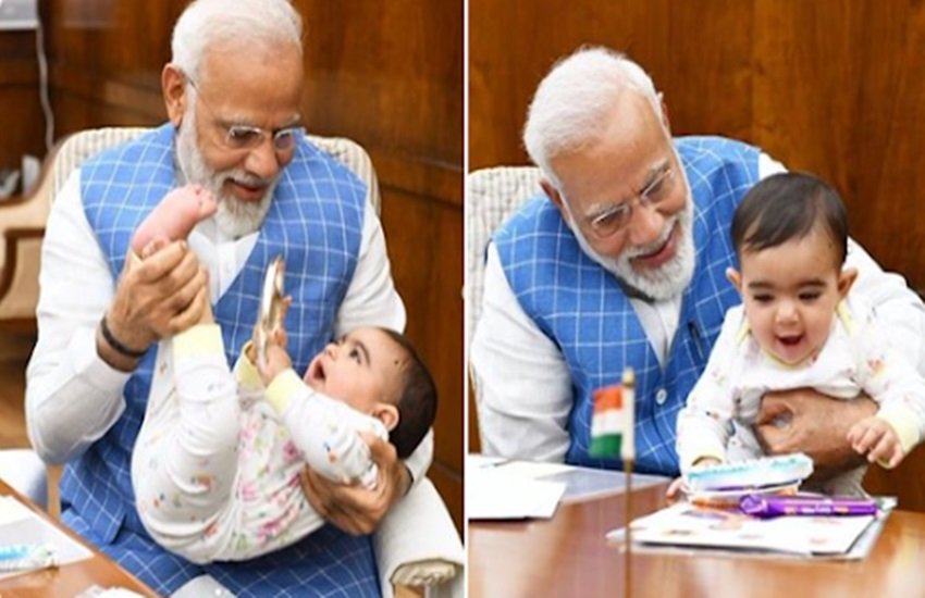 संसद में बच्चे के साथ ली गई प्रधानमंत्री नरेंद्र मोदी की तस्वीर