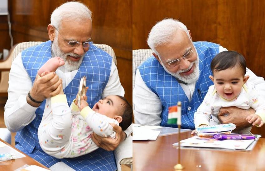 Baby in Parliament, modi, MODI BABY, Modi Instagram, MODI POSES WITH BABY, Narendra Modi, pm modi, PM Modi with baby, pm narendra modi, viral photo