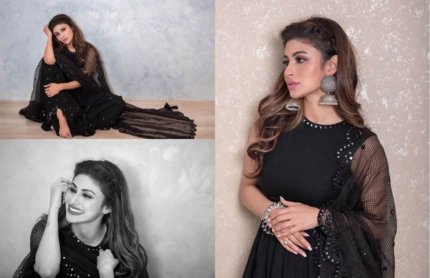 टीवी से बॉलीवुड तक का सफर तय करने वालीं मौनी रॉय इन दिनों शोहरत की बुलंदियों पर हैं। मौनी की बैक टू बैक फिल्में आ रही हैं। अक्षय कुमार के साथ फिल्म गोल्ड से बड़े पर्दे पर एंट्री मारने वालीं मौनी रॉय मंझे हुए कलाकारों के साथ फिल्में कर रही हैं। फिल्मों के साथ ही वह सोशल मीडिया में भी खूब एक्टिव हैं। आए दिन वह अपनी तस्वीरें अपने फैंस के साथ शेयर करती रहती हैं। हाल ही में मौनी ने ब्लैक ड्रेस में अपनी कुछ तस्वीरें इंस्टाग्राम पर शेयर कीं। ये तस्वीरें उनके फैंस को खूब पसंद आ रही हैं। (All Pics: Mouni Roy Instagram)