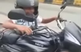 Motor Vehicle Act, 8 year old child driving bike, child driving bike in lucknow, lucknow viral video, child gets fine, traffic rule and fine